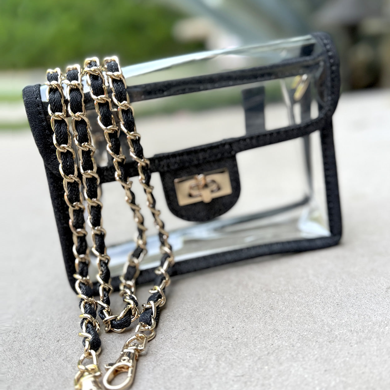 Clear, stadium approved black denim trim purse / fanny pack with a gold chain