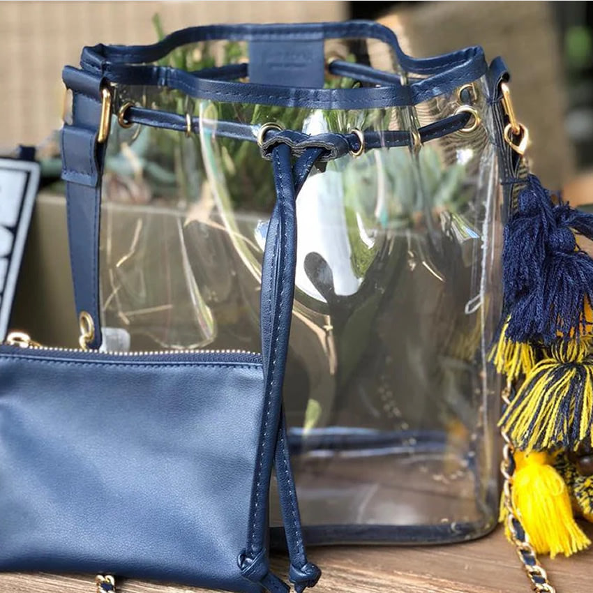 Clear, stadium compliant bucket-bag tote with a navy blue accessory pouch and team colored tassels