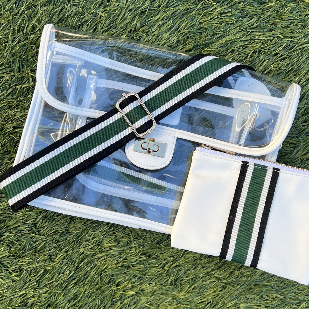 Clear, stadium approved purse with striped green and black strap
