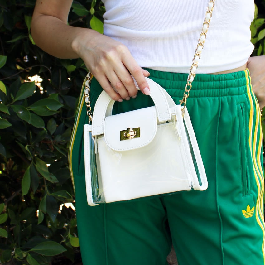 Fashionable stadium compliant purse with white trim and gold chain