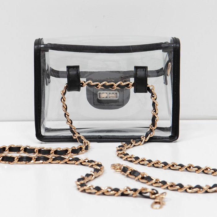 Gold chain threaded through the back of a convertible fanny pack / crossbody purse