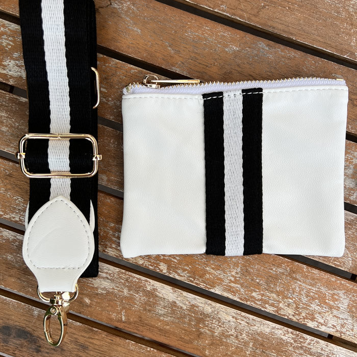 Faux-leather white accessories pouch with matching black and white striped purse strap