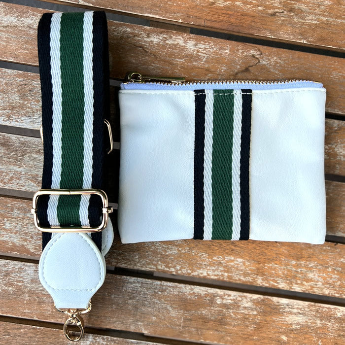 Faux-leather white accessories pouch with matching white, black, and green striped purse strap