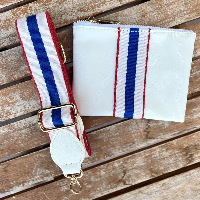 Faux-leather white accessories pouch with matching red, white and blue striped purse strap