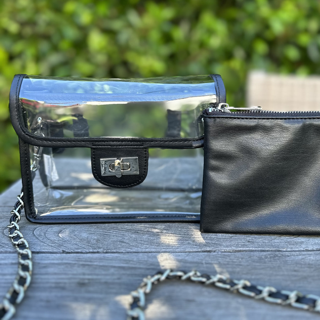 Clear, stadium approved black faux-leather trim fanny-pack purse with a silver chain