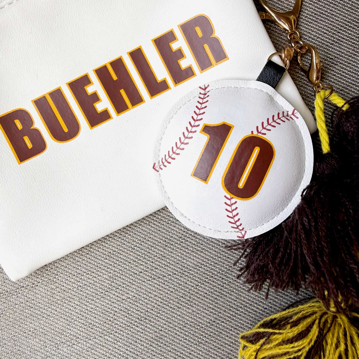 Baseball shaped purse tag for stadium approved handbags