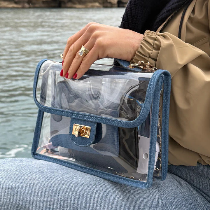 Person on a cruise with a denim see-through handbag