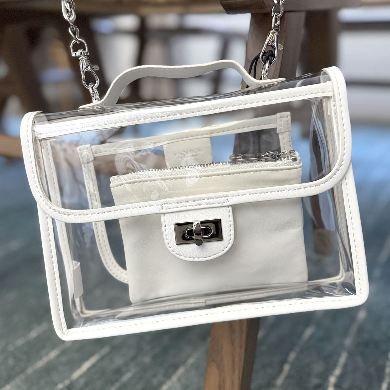 Clear, stadium-approved white purse with a silver chain