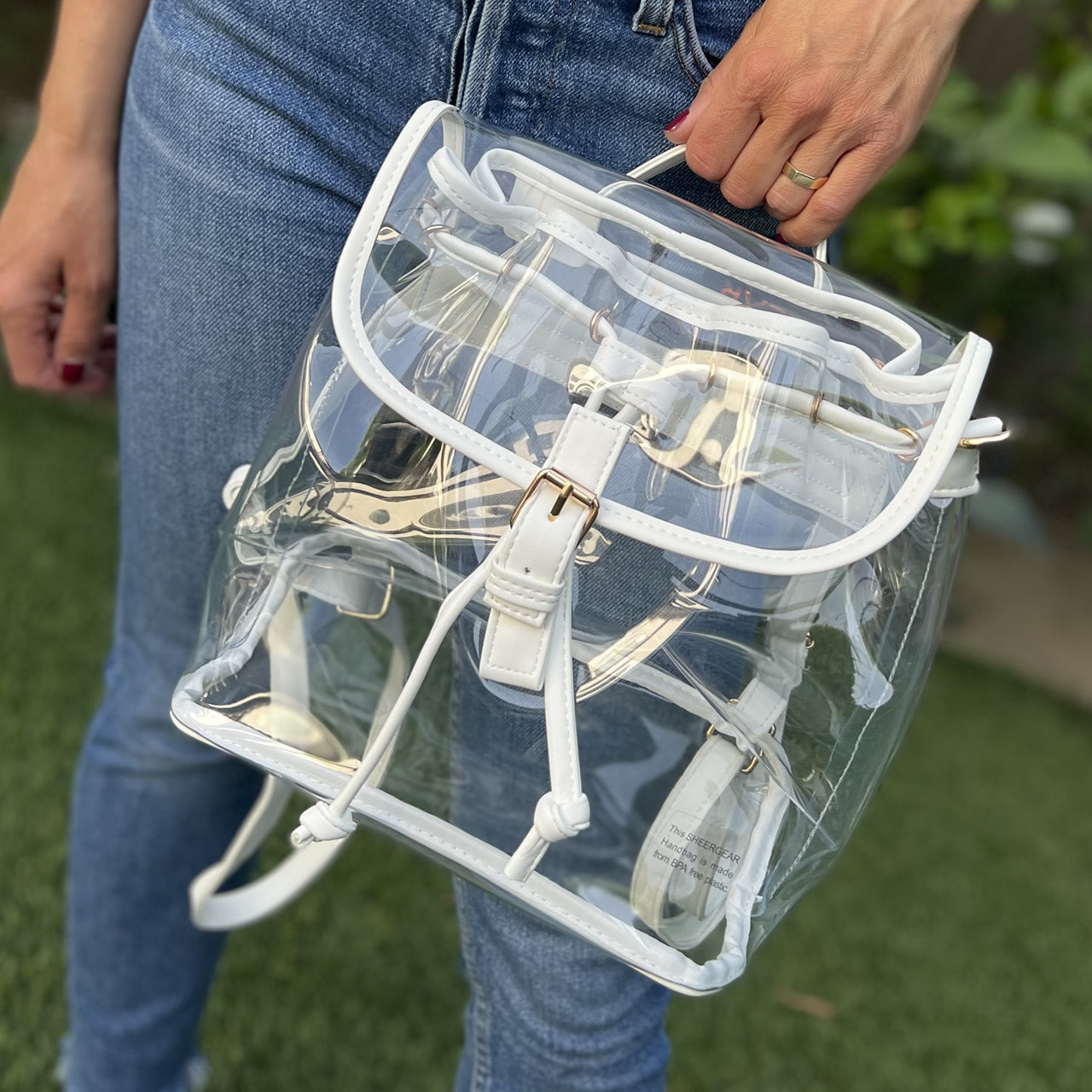 Stadium approved backpack with white faux-leather trim.