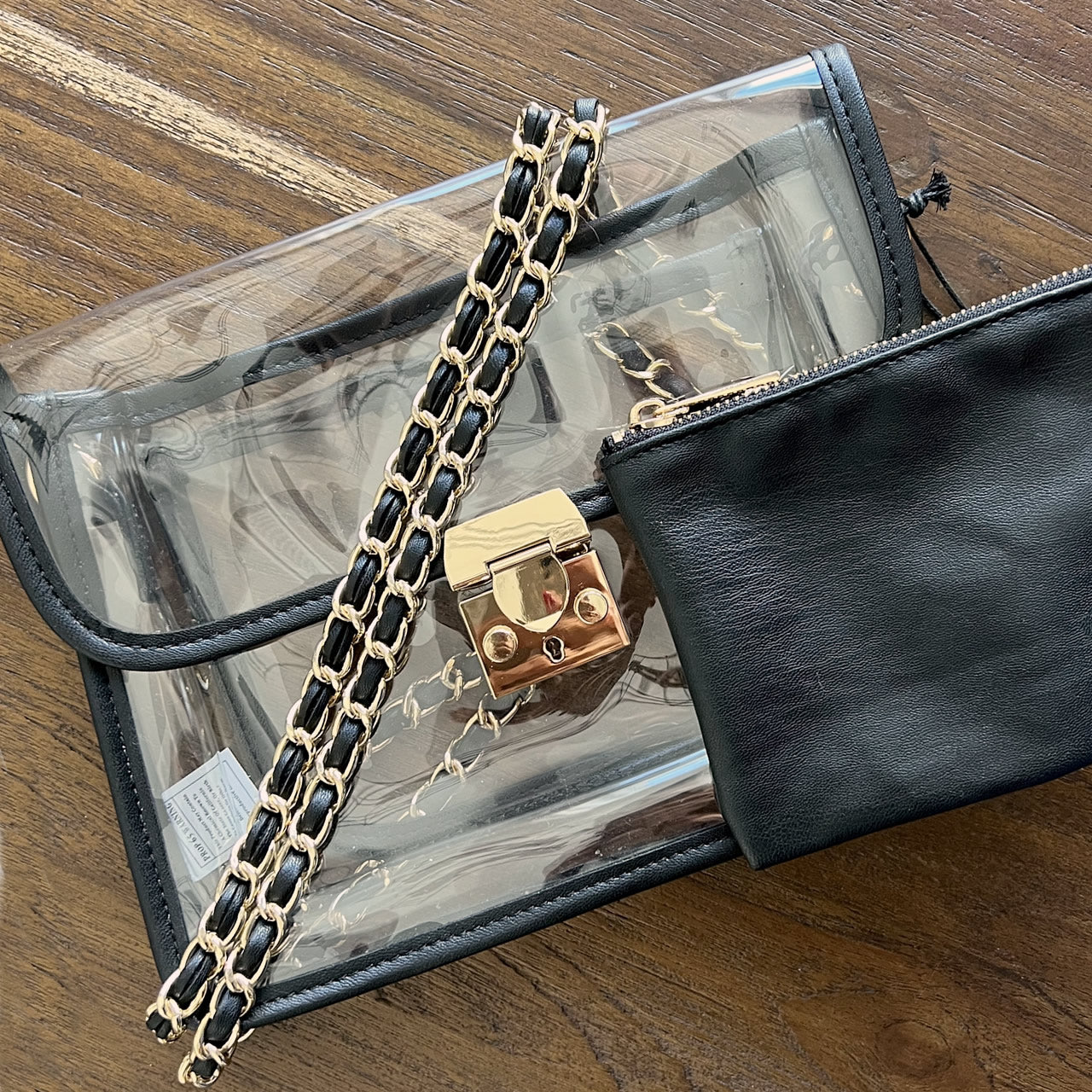 Black stadium approved clear purse with gold chain.