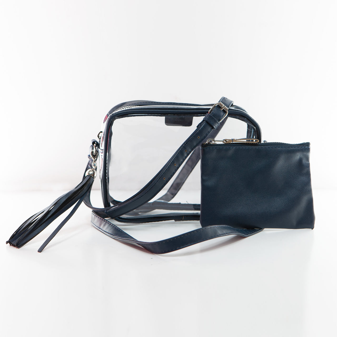 Clear, stadium handbag with navy trim, tassel, strap, and matching accessory pouch
